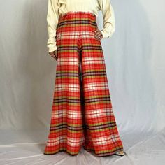 "1960s Plaid Elephant Bell Bottoms Super fun and seasonal bright red plaid elephant bell bottoms from the 1960s. Elastic waistband, and likely 100% acrylic. Tagged a vintage size 10 but would best fit a petite modern XXS-S, depending on desired fit. (Model is 5'1\") Waist: 24-28\" Hip: 42\" Rise: 14\" Thigh: 13.5\" flat Inseam: 29.5\" Flare: 43\" Condition: Excellent, no flaws to note." Retro Red Bottoms For Fall, Red Vintage Bottoms For Fall, Vintage Red Pants For Fall, Retro Plaid Pants For Fall, Retro Red Bottoms For Winter, Art Teacher Outfits, Autumn 2024, Womens Pants, Teacher Outfits