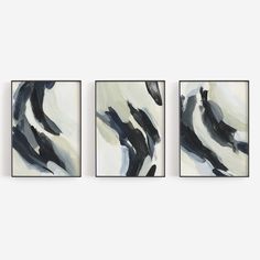 three abstract paintings hang on the wall