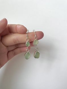 Nickel-free Teardrop Recycled Glass Jewelry, Green Dangle Earrings In Recycled Glass, Green Dangle Earrings With Recycled Glass, Silver Sea Glass Drop Earrings, Nickel-free Teardrop Earrings In Recycled Glass, Green Recycled Glass Dangle Earrings, Nickel-free Teardrop Earrings Made Of Recycled Glass, Silver Sea Glass Dangle Earrings, Handmade Sea Glass Dangle Earrings