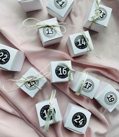 small boxes with numbers and ribbons tied around them