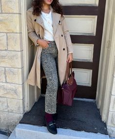 The Longchomp burgundy tote bag is the perfect addition to this fall fashion outfit. This chic Parisian outfit is perfect for fall or as an early winter outfit. Made by pairing a cardigan, leopard pants, trench coat, burgundy socks, and loafers. Socks And Loafers, Parisian Outfit, Longchamp Bag, Early Winter