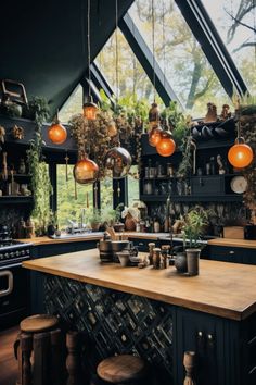 a kitchen with lots of plants and hanging lights