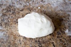 a ball of dough sitting on top of a counter