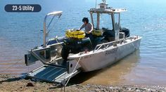 a man on a boat in the water with luggage strapped to it's back