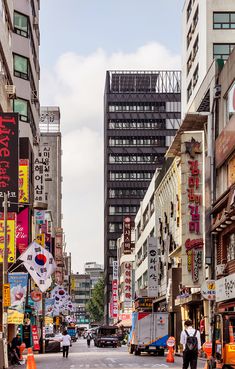 a city street filled with lots of tall buildings