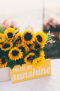 sunflowers are in a vase with the words you are my sunshine on it