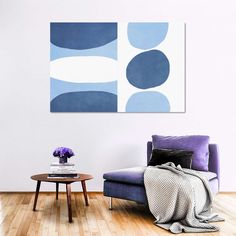 a living room scene with focus on the sofa and chair, which has an abstract blue design