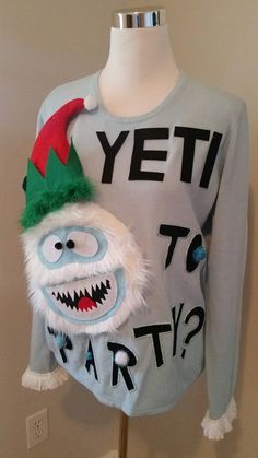 an ugly christmas sweater is on display in front of a mannequin's head