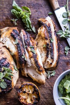 grilled chicken with herbs and spices on a cutting board