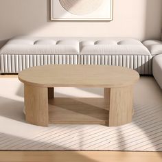 a living room with white couches and a wooden coffee table in the center area