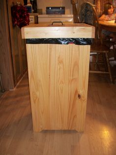 a wooden box sitting on top of a hard wood floor