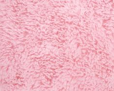 a close up view of the texture of a pink furry animal fur material that is soft and fluffy