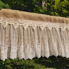 an old curtain is hanging outside in the sun