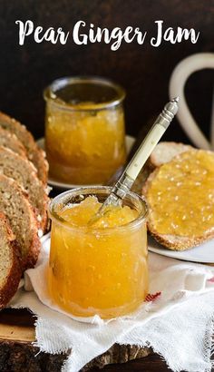 a glass jar filled with jam next to slices of bread