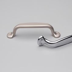 an image of a metal handle on a gray background