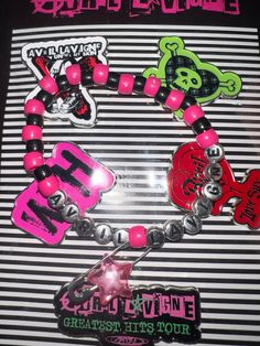 Made this bracelet for her Greatest Hits tour and was pretty proud of it so feel free to copy it #avrillavigne #avrillavigneaesthetic #avrillavignetour #greatesthitstour #poppunk #punkrock #punk #rock #poprock #kandi #kandikid #bracelet #diy #letgo #lovesux #thebestdamnthing #goodbyelullaby #headabovewater #girlfriend #complicated #whatthehell #2000s #y2k Paramore Bracelet, Band Kandi Bracelets, Avril Lavigne Bracelets, Avril Lavigne Tour, Avril Lavigne Aesthetic, Skull Kandi Cuff Pattern, Emo Kandi Cuff, Rave Kandi Bracelets Love & Path