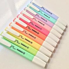 six different colored pens are lined up in a row on a white surface with the words philips written below them