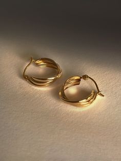 DESCRIPTIONHere’s a TWIST on your classic gold hoops. These babies feature a triple twist design that makes a bold & chunky impact with minimum lightweight effort. TWIST the rules & make a statement at the same time. DETAILS - always made in 14k gold- hoop diameter: 14mm- hoop width: 5mm Gold Hoop Earrings Outfit, Engagement Earrings, Golden Earrings, Classic Gold, Senior Pics, Gold Hoops, Gold Hoop, Hook Earrings, Gold Hoop Earrings