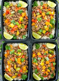 four black trays filled with rice, meat and veggies next to lime wedges