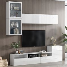 a living room with white furniture and a large flat screen tv mounted on the wall