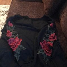 Black T Shirt With Distressing And Flower Embroidered Patches On Sleeves. Never Worn! Black Embroidered T-shirt For Fall, Black Tops With Embroidered Graphics For Fall, Black Embroidered Crew Neck Top, Black Embroidered Tops For Fall, Black Long Sleeve Tops With Embroidered Graphics, Embroidered Black T-shirt For Fall, Black Floral Embroidery Crew Neck T-shirt, Black T-shirt With Floral Print For Fall, Black Long Sleeve Floral Print T-shirt