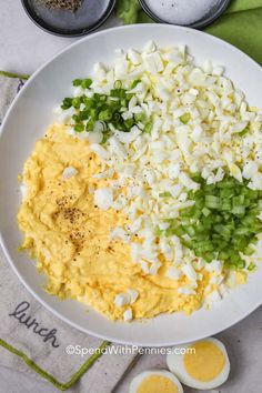 an image of scrambled eggs and onions on a plate