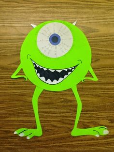 a paper cut out of a monster with big eyes