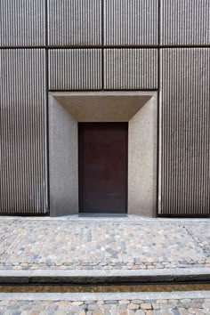 an entrance to a building with stone steps leading up to it and a door in the middle