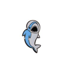 a blue and white shark pin with an open mouth on it's back side