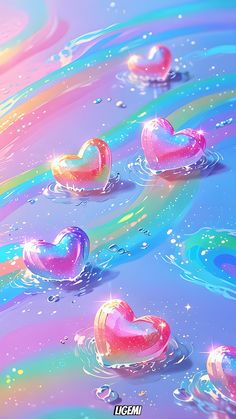 three hearts floating in the water on a rainbow colored background with bubbles and sparkles