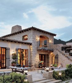 an outdoor patio with steps leading up to the house