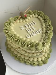 a heart shaped cake with the words happy birthday on it