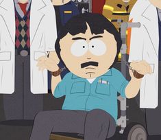 a man sitting in a wheel chair with his hands on his head and other people standing behind him