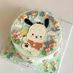 there is a cake decorated with animals and letters