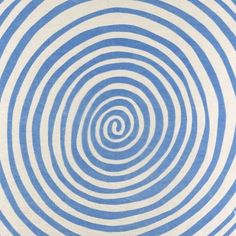 a blue and white striped pillow with an abstract design on the front, featuring a spiral pattern