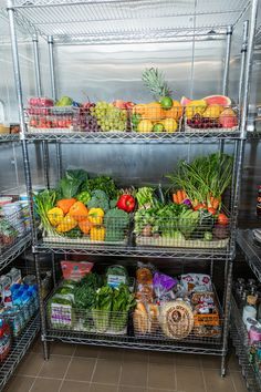 several shelves filled with fruits and vegetables in a grocery store