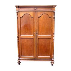 an old wooden armoire with two doors