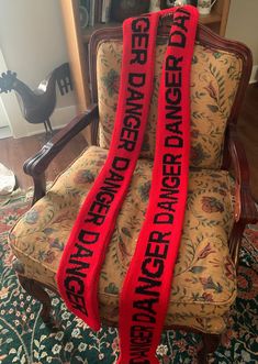 "Danger Scarf Super long knit scarf looks just like a danger tape.  Bright red knit scarf with black letters.  The words are on BOTH sides of the scarf.  Yarn is soft and cozy so you can wear it long or wrap it around. Scarf is 4\" wide and a super long 94\".   Made of soft acrylic yarn.  Machine washable. More \"tape\" scarves here: https://www.etsy.com/shop/blazingneedles?section_id=37766669 What others are saying: \"AMAZING!! super comfy super warm and soft. I'm always worried about purchasin Red Knit Scarf, Crochet Letters, Caution Tape, Cooling Scarf, Scarf Yarn, Tapestry Crochet Patterns, Cold Morning, Very Cold, Booth Ideas