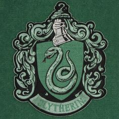 a green harry potter crest with a snake on it