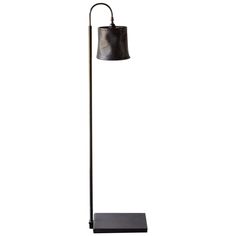 a floor lamp with a black shade on the base and a white light behind it