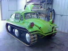 a green car is parked in a garage