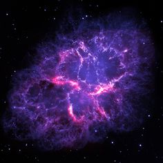 an image of a very bright purple object in the dark sky with stars around it