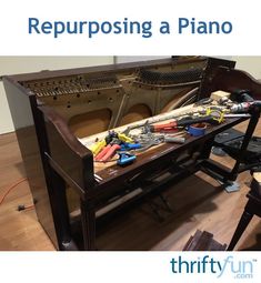 a piano being worked on with tools in front of it and the words repurposing a piano