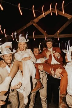 a group of people dressed in costumes posing for a photo