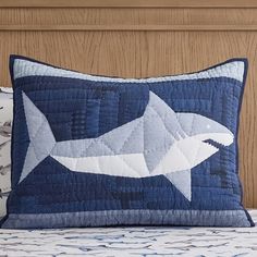 a pillow with a shark design on it