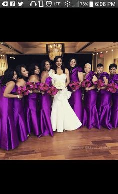 a bride and her bridal party in purple dresses