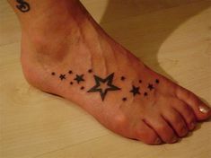 a person has a star tattoo on their foot