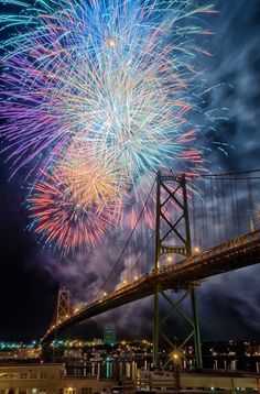 fireworks over the bay bridge in san francisco