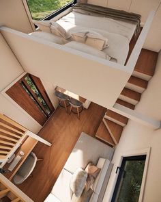 an aerial view of a bedroom and living room in a tiny house with stairs leading up to the second floor