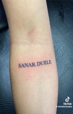 a small tattoo with the word sanardule on it